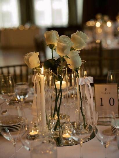 Wedding welcome details alongside a floral installation
